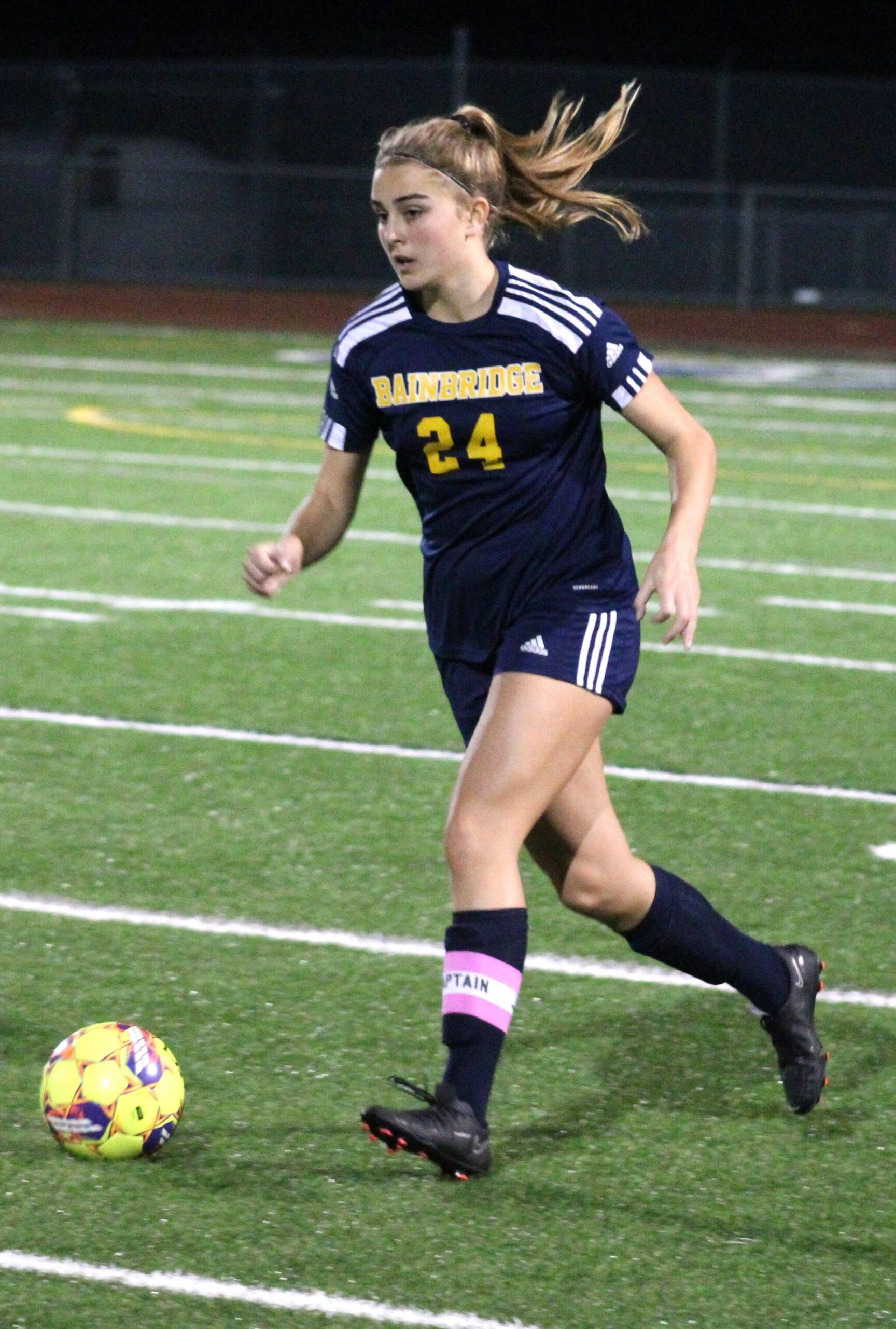 Bainbridge senior Grace Rich dribbles down the field in the first half of a match with Kingston.