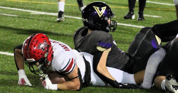 Elisha Meyer/Kitsap News Group photos
Senior Lelond Anderson helps bring down an East Valley ball carrier.