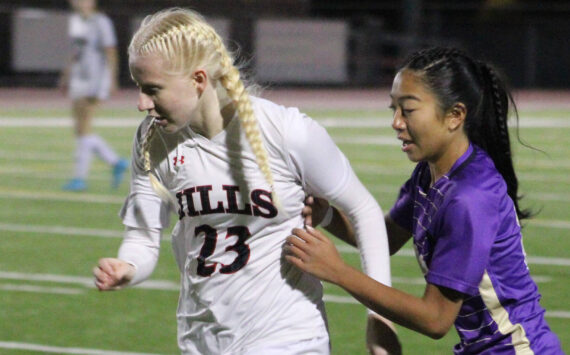 Elisha Meyer/Kitsap News Group
North Kitsap junior Addy Jueco tries to get the ball from a Lumberjills player in the first half of the Vikings' state opener.