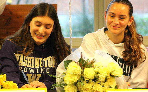 Elisha Meyer/Kitsap News Group
Bainbridge’s Hannah Kress and Adeline Carleton celebrate their rowing commitments to Washington and Michigan State.