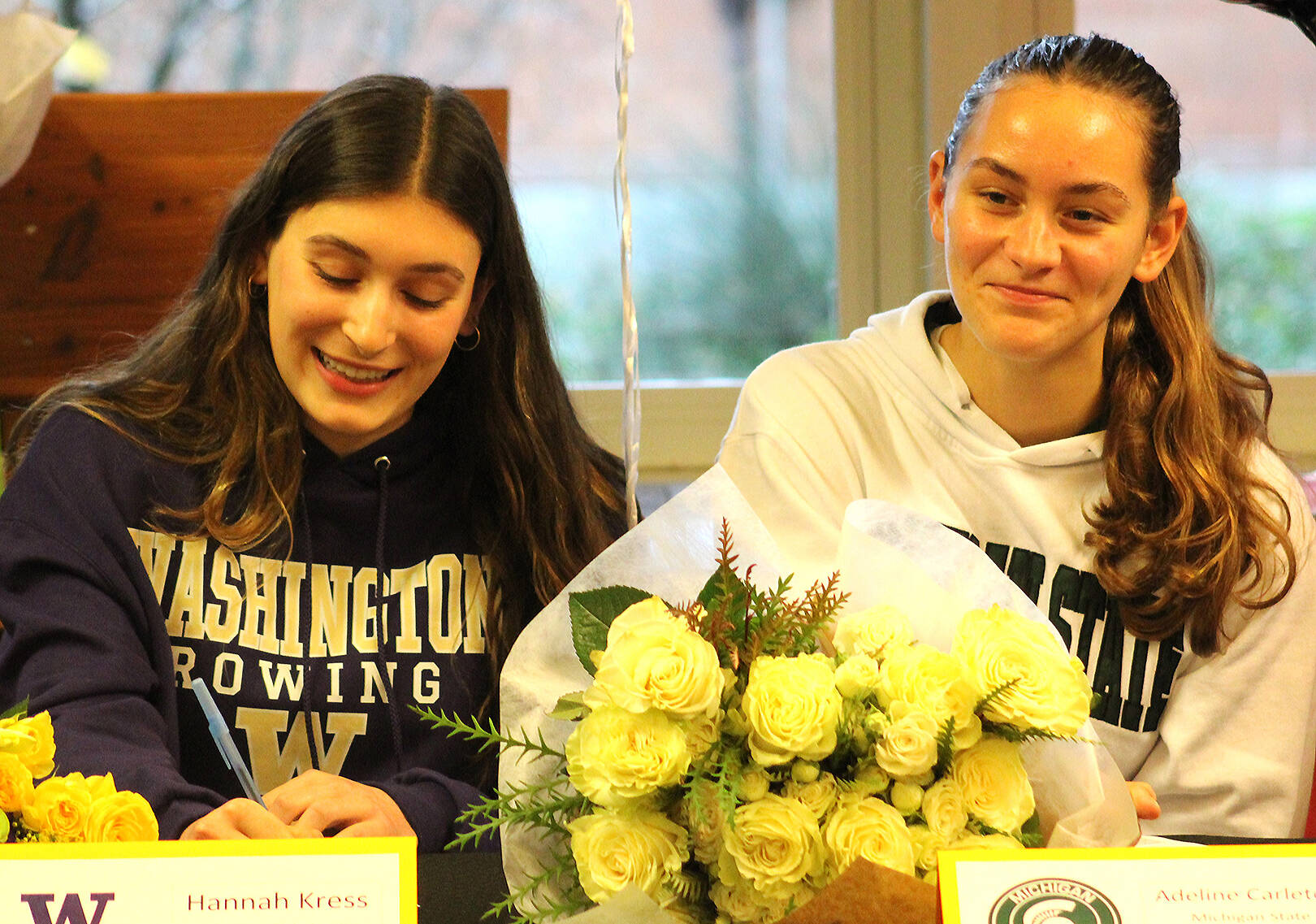 Elisha Meyer/Kitsap News Group
Bainbridge’s Hannah Kress and Adeline Carleton celebrate their rowing commitments to Washington and Michigan State.