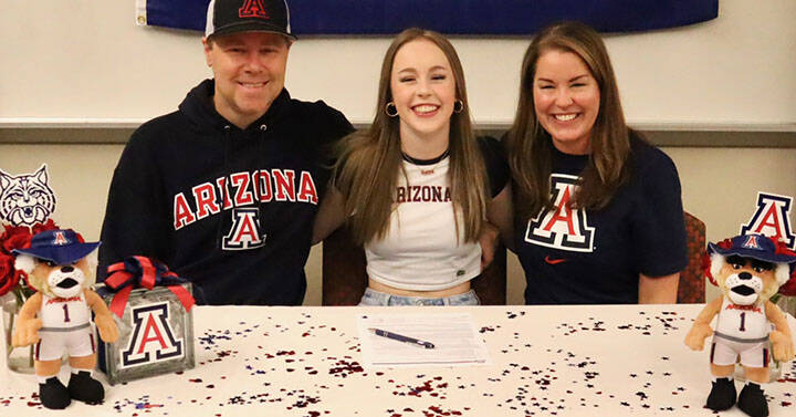 Mead Family courtesy photo
Kingston senior Delaney Mead (middle) signed her letter of intent to attend the University of Arizona Nov. 13 at Kingston High School. Joining her was dad Cory and mom Shannon.