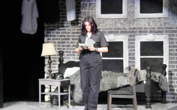 Molly Hetherwick/Kitsap News Group photos
Working-class ‘greaser’ Ponyboy (Lily Terp) reads an inscription in a friend’s book.