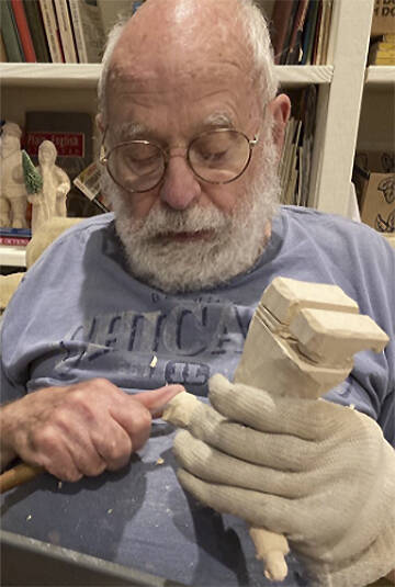 Bob Pedersen loved to carve Santas for Christmas House.