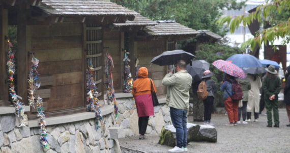 Molly Hetherwick/Kitsap News Group
Visitors check out the memorial on a rainy day. A proposal would put a permanent employee on the site to guide visitors.