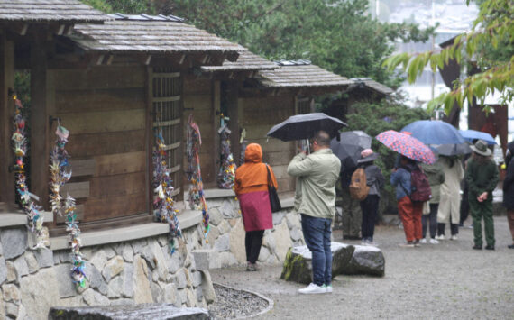 Molly Hetherwick/Kitsap News Group
Visitors check out the memorial on a rainy day. A proposal would put a permanent employee on the site to guide visitors.