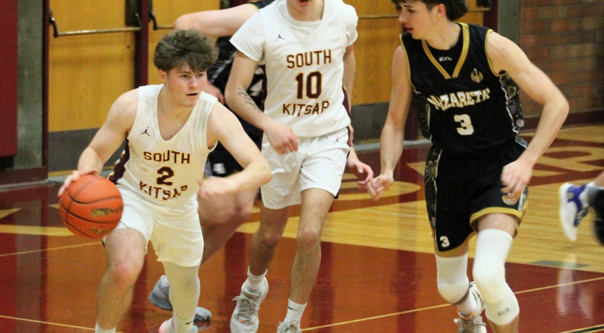 South Kitsap senior Boden Harvey takes a rebound back the other way in a second-half possession.