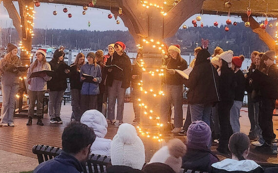 Tyler Shuey/Kitsap News Group photos
The North Kitsap High School choir gets the festivities started with some Christmas carols.