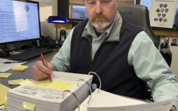 Mike De Felice/Kitsap News Group
Sgt. Jason Vertefeuille of the Bremerton Police Department pours over reports of stolen vehicles in Kitsap County and looks for trends. His work has dramatically reduced the number of such thefts.