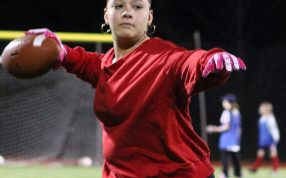 Elisha Meyer/Kitsap News Group photos
Kingston senior Joey Castillo warms up her arm before an evening flag football practice.