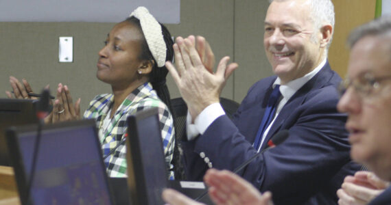 Molly Hetherwick/Kitsap News Group
Bainbridge Island deputy mayor Ashley Mathews, left, and Mayor Joe Deets applaud a proclamation at the council meeting Dec. 10.