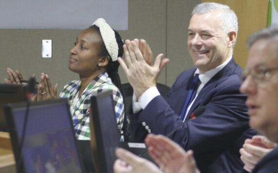 Molly Hetherwick/Kitsap News Group
Bainbridge Island deputy mayor Ashley Mathews, left, and Mayor Joe Deets applaud a proclamation at the council meeting Dec. 10.