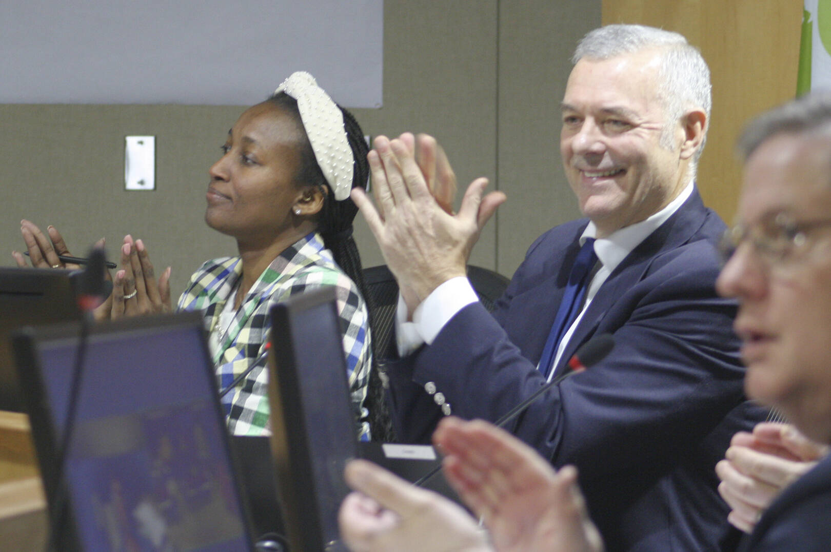 Molly Hetherwick/Kitsap News Group
Bainbridge Island deputy mayor Ashley Mathews, left, and Mayor Joe Deets applaud a proclamation at the council meeting Dec. 10.