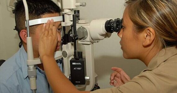 US Navy courtesy photo
A Navy optometrist administers a slit lamp eye exam, a routine procedure that is difficult to obtain for United members in Kitsap County.