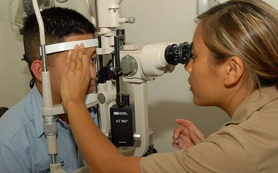 US Navy courtesy photo
A Navy optometrist administers a slit lamp eye exam, a routine procedure that is difficult to obtain for United members in Kitsap County.