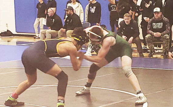 Mark Storer/Kitsap News Group photos
Omid Neghabat of Bainbridge takes on Cole Anderson of Port Angeles at the North Mason wrestling tournament.