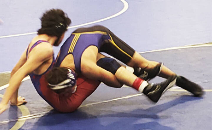 Tristan Hosterman of North Kitsap takes down Montay McQueen of Rogers of Spokane at the North Mason tourney, but McQueen came back to win the match.